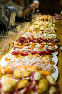 Spanish snacks (Pintxos) on the counter of the tapas bar in the gastronimical capital of Spain - San Sebastian.